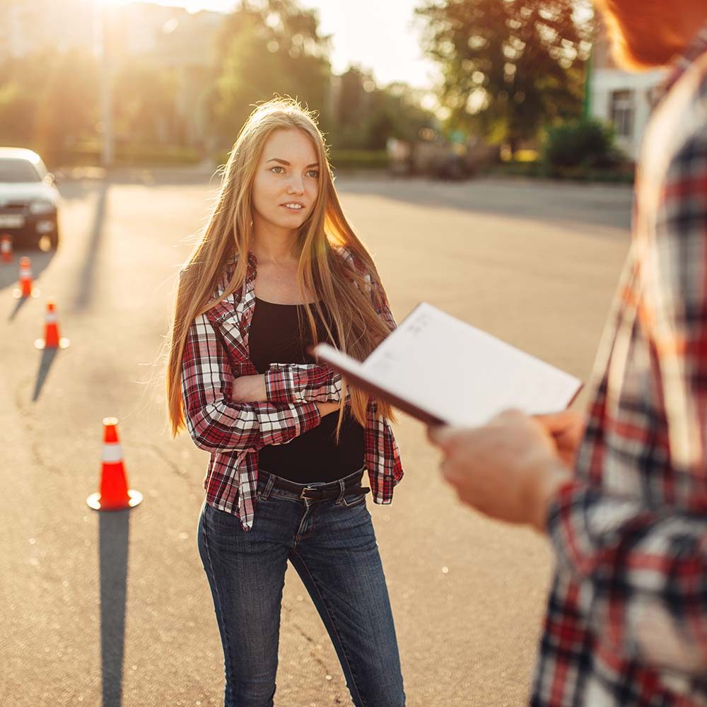 male-instructor-and-female-student-driving-school-REZNS5U.jpg